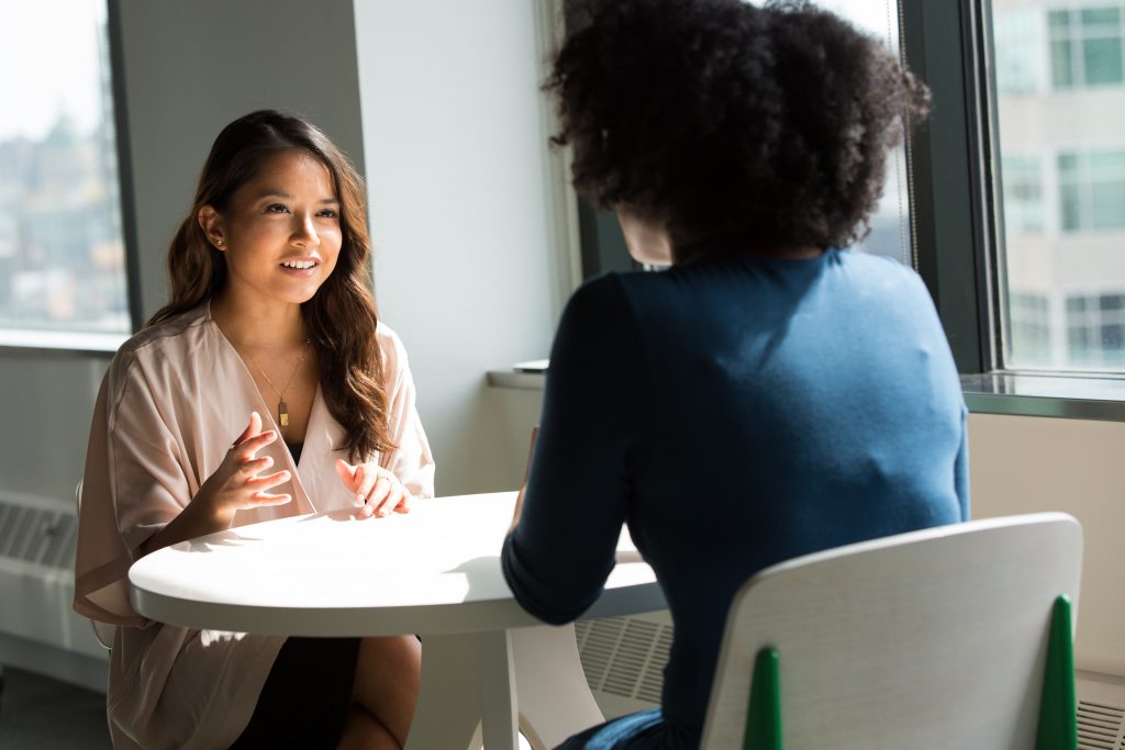 two women in a work meeting